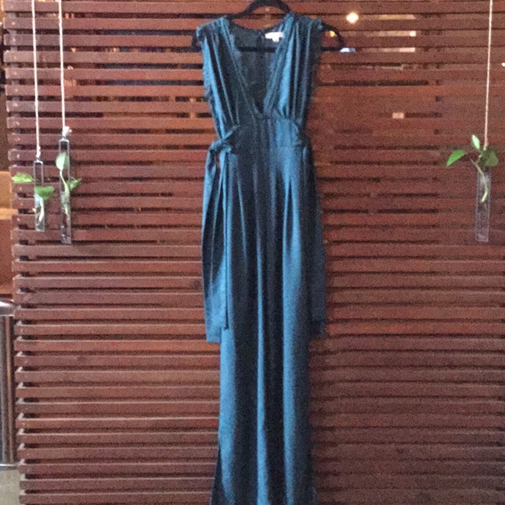 Floor length pants romper with lace accent.